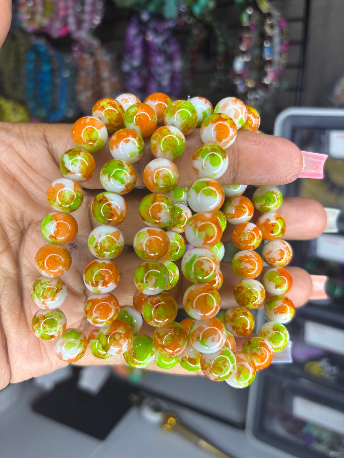 Orange and green beaded bracelet