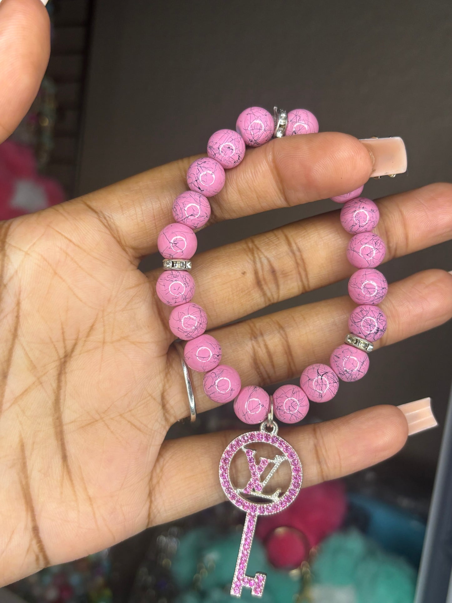 Pink Louis Vuitton charm bracelet